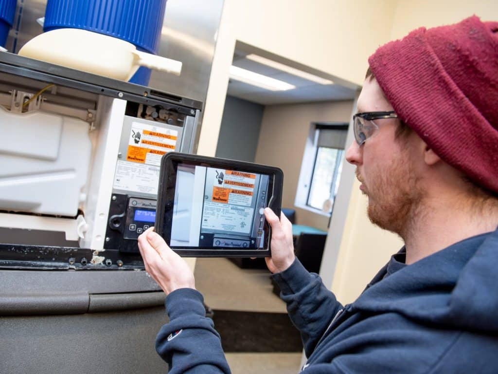 Medford Technician Taking Picture With Ipad